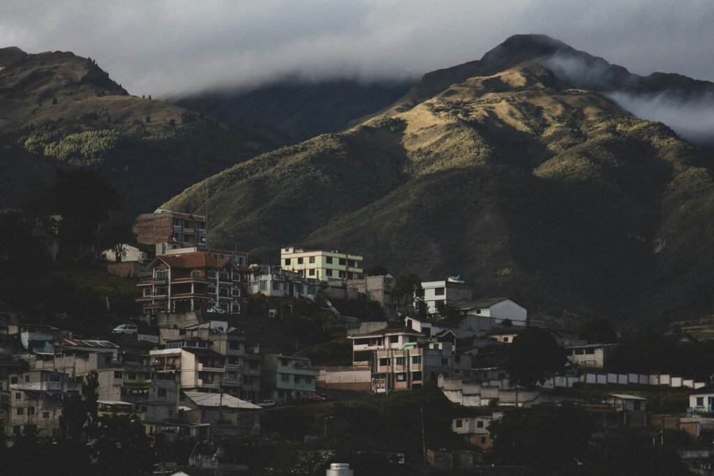 Mountains rise in the distance behind a town in Ecuador. Wheely Tyred attractions to visit in Otavalo