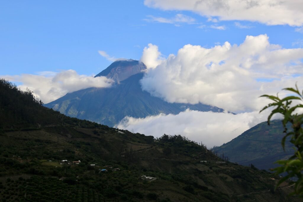 Volcán Tungurahua can be seen through the clouds near Baños, Ecuador