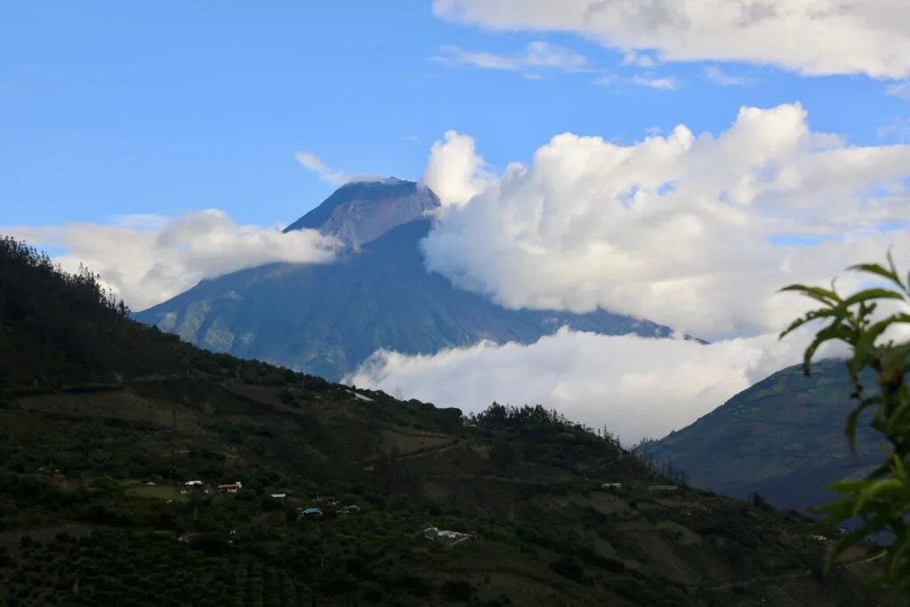 Volcán Tungurahua can be seen through the clouds near Baños, Ecuador