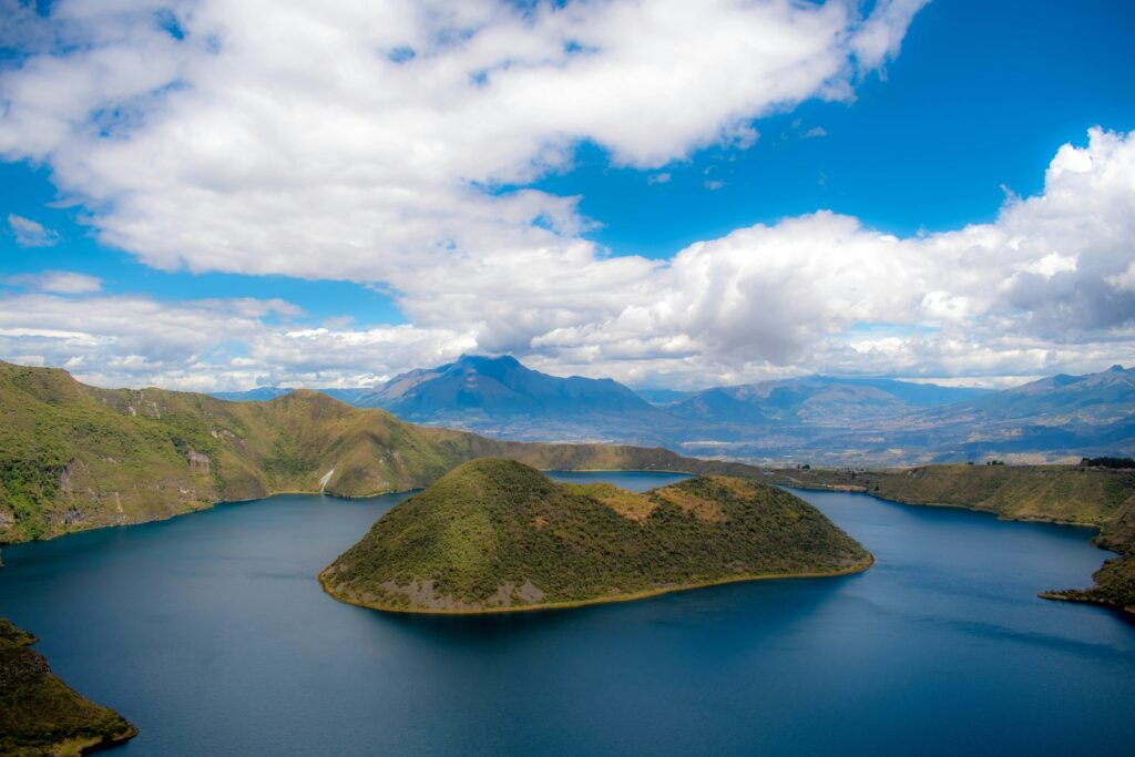 A large island sits in the middle of a caldera lake at Laguna Cuicocha, near Otavalo, Ecuador.