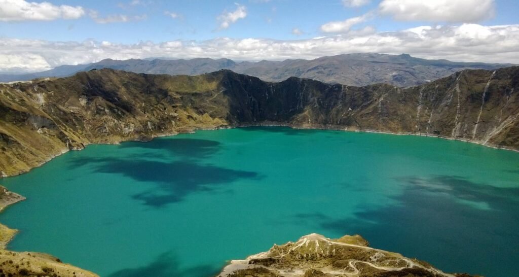 An emerald lake under the sun in Ecuador. Wheely Tyred Best Quilotoa multi-day tours