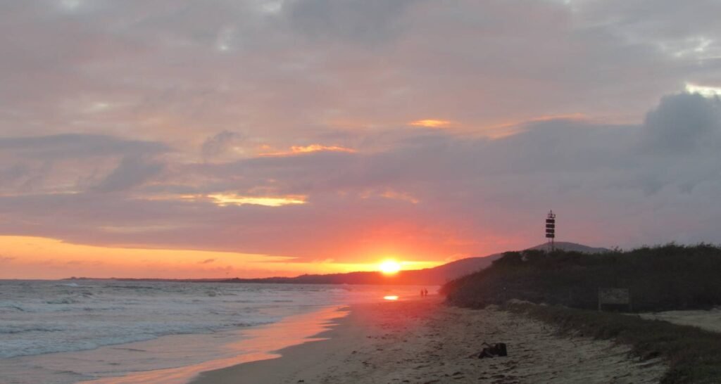 The sun sets over a beach in The Galápagos, Ecuador