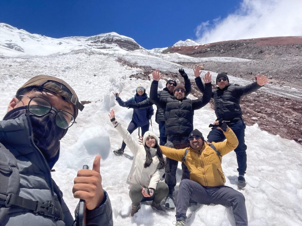A group of people pose for a photograph in the snow on the side of Cotopaxi, Ecuador