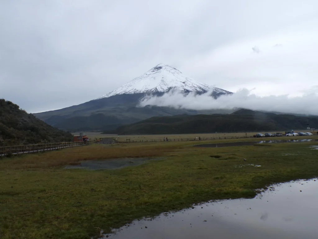 Cotopaxi Volcano and a lagoon under a grey sky