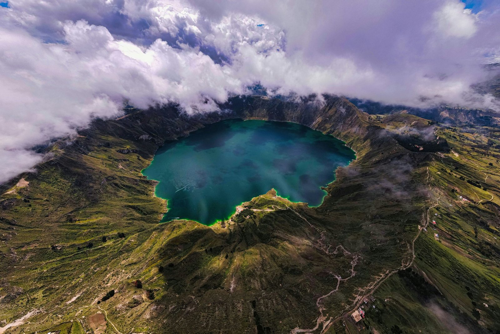 The caldera at Lake Quilotoa is full of blue water in Ecuador.