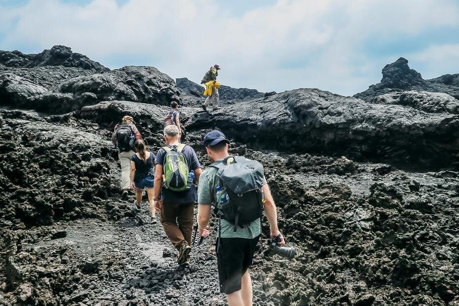 A group hike across basalt to the caldera of rhe Sierra Negra on Isla Isabela, Galápagos