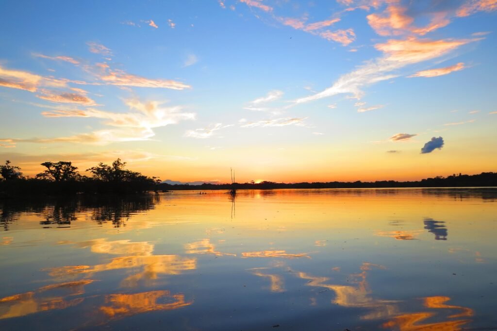 The sun sets over Lago Agrio, near Cuyabeno, Ecuador