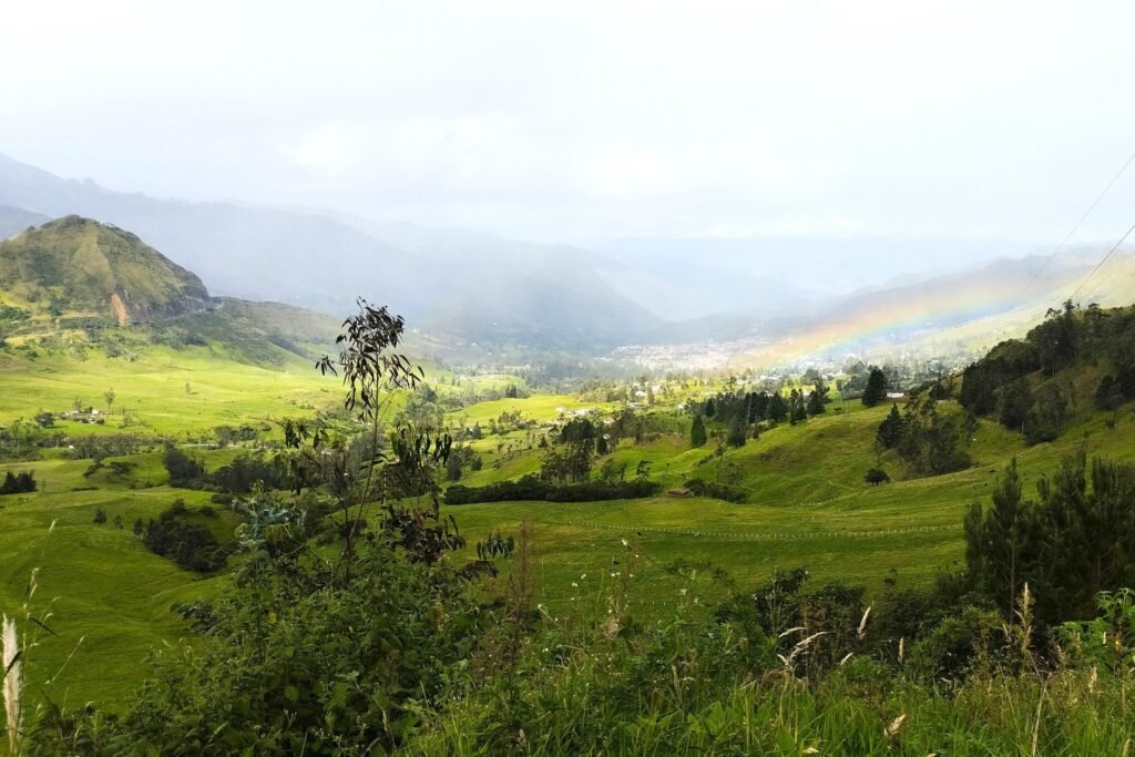 A valley in the Andes full of fields and clouds, near Cuenca, Ecuador