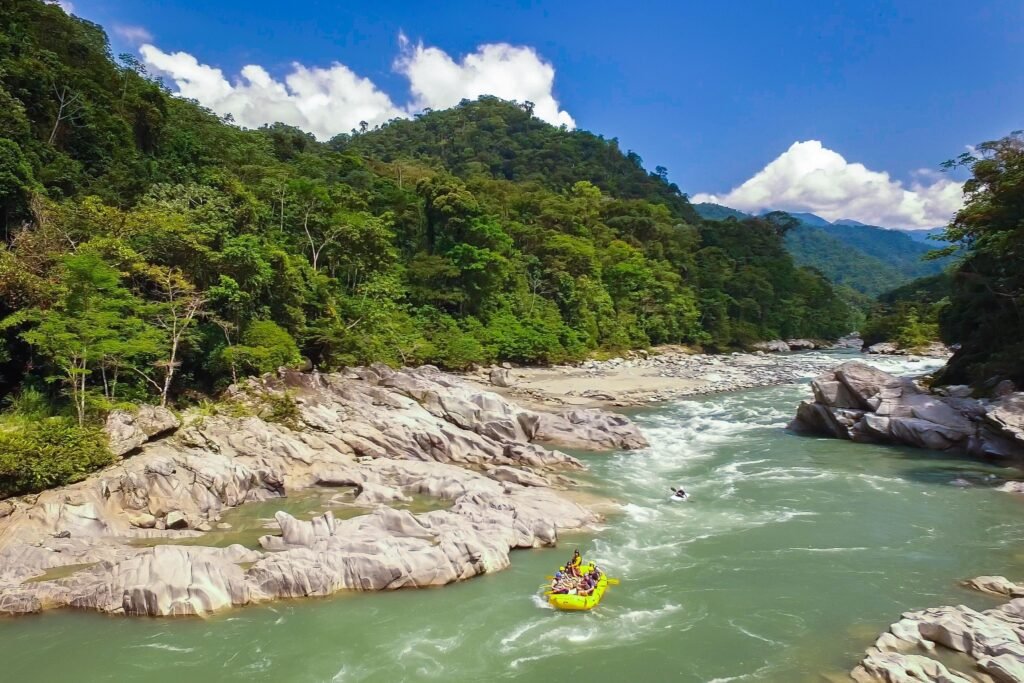 A group rafts through white water on the Pastaza river near Baños, Ecuador