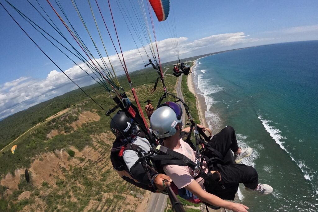 People paraglide over the coast near Moñtanita, Ecuador