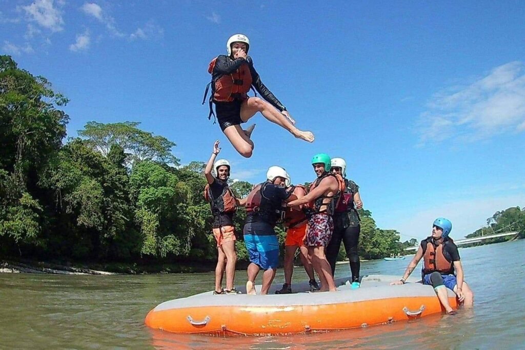A person is thrown into a river from a rubber dinghy in the Amazon, Ecuador