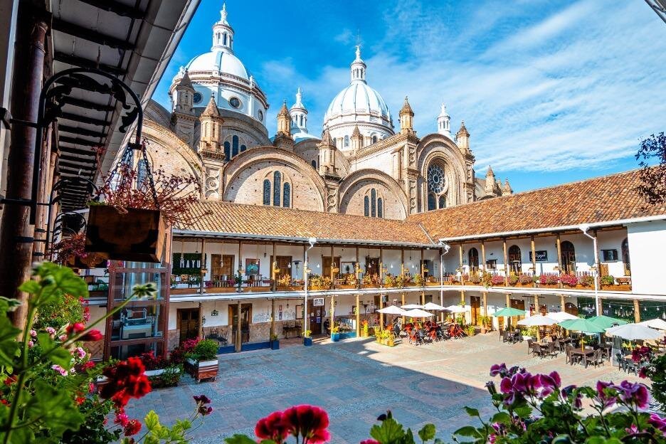 The domes of the new cathedral as viewed from the restaurants in the cloisters, in Cuenca, Ecuador