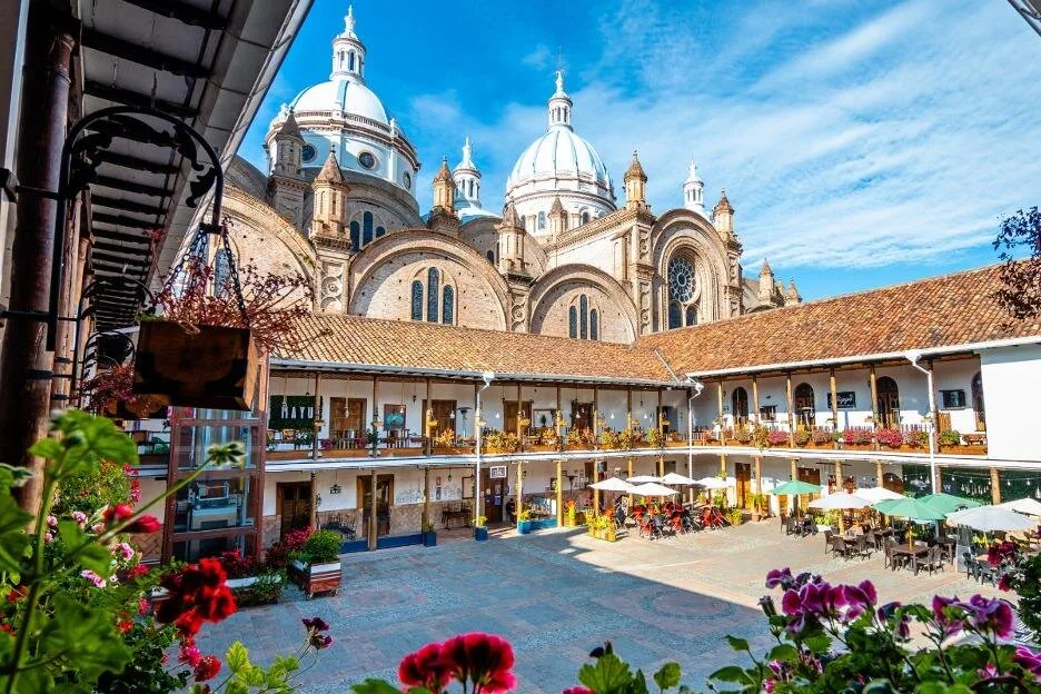 The domes of the new cathedral as viewed from the restaurants in the cloisters, in Cuenca, Ecuador