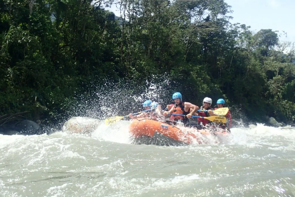 A raft plunges through rapids on the Pastaza River, near Baños, Ecuador