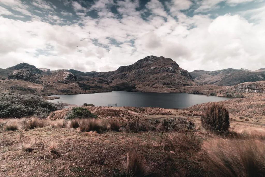 A wide view of the main lake surrounded by paramo in Cajas National Park, near Cuenca, Ecuador