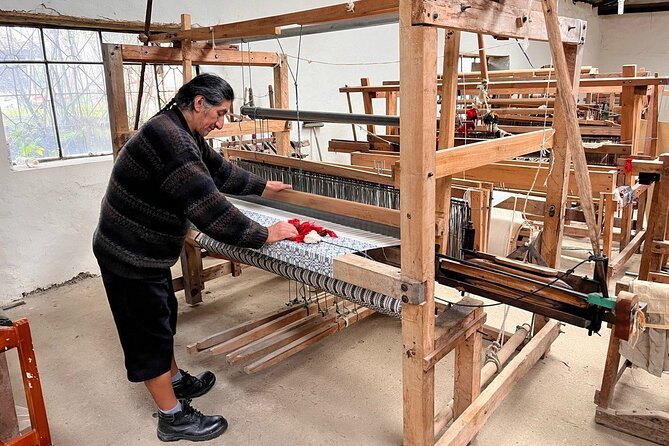 A man stands at a loom in Saraguro, near Loja, Ecuador