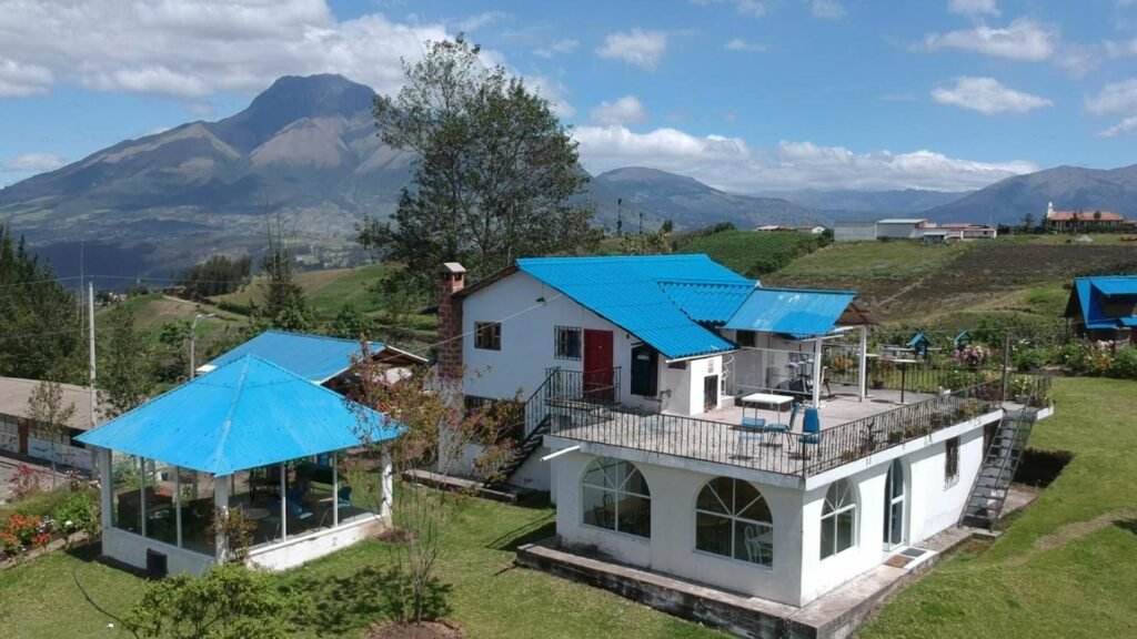 Hosteria Rose Cottage can be seen in fields under Volcan Imbabura, near Cotocachi and Otavalo, Ecuador