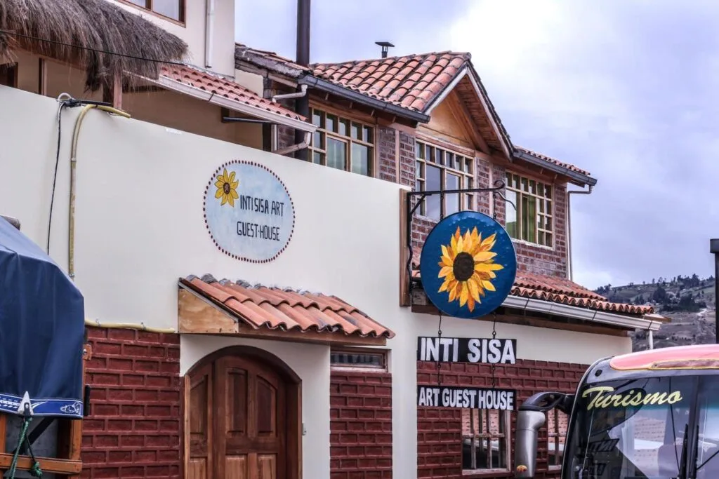 A tour bus waits outside the Inti Sisa Art Guesthouse near Chimborazo, Ecuador