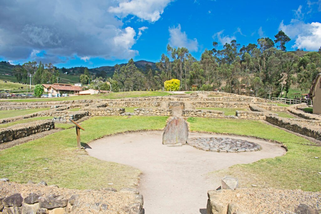 Ruins at the Ingapirca complex under a blue sky in Ecuador