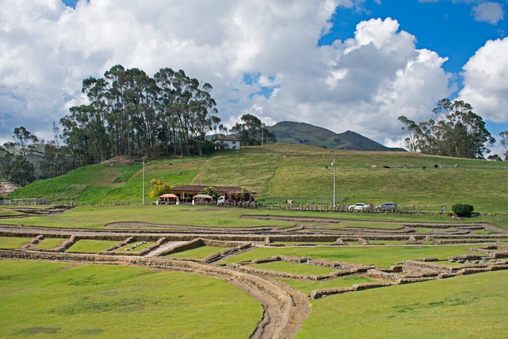 Ruins at the Ingapirca complex under a blue sky in Ecuador