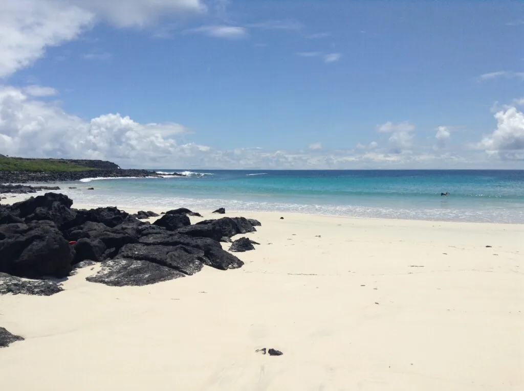 Light blue water laps against Puerto Chino Beach, on San Cristobal, Galapagos Islands