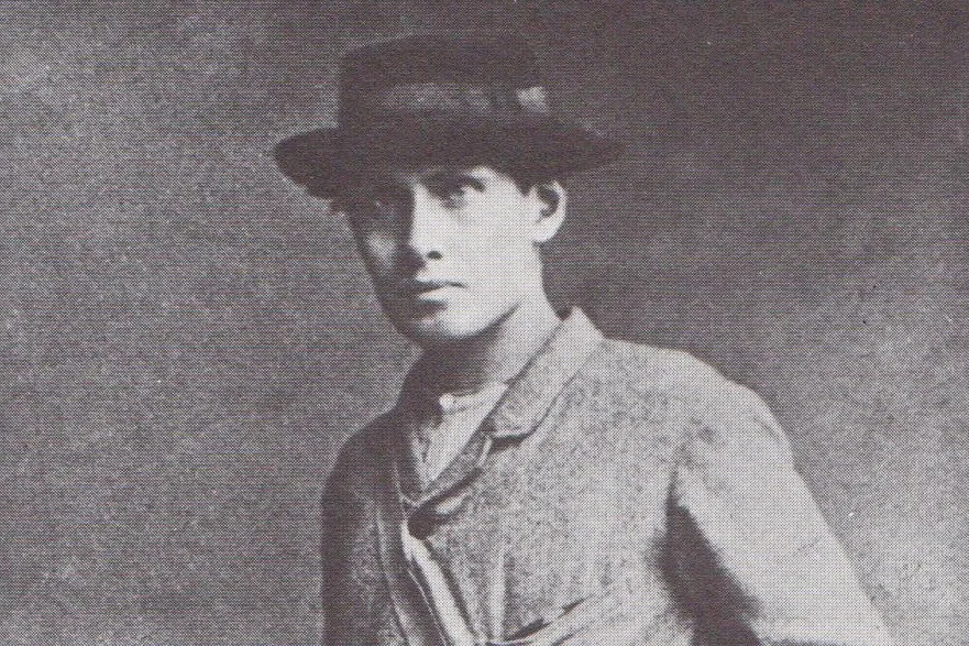 A black and white photo of Edward Whymper in a hat