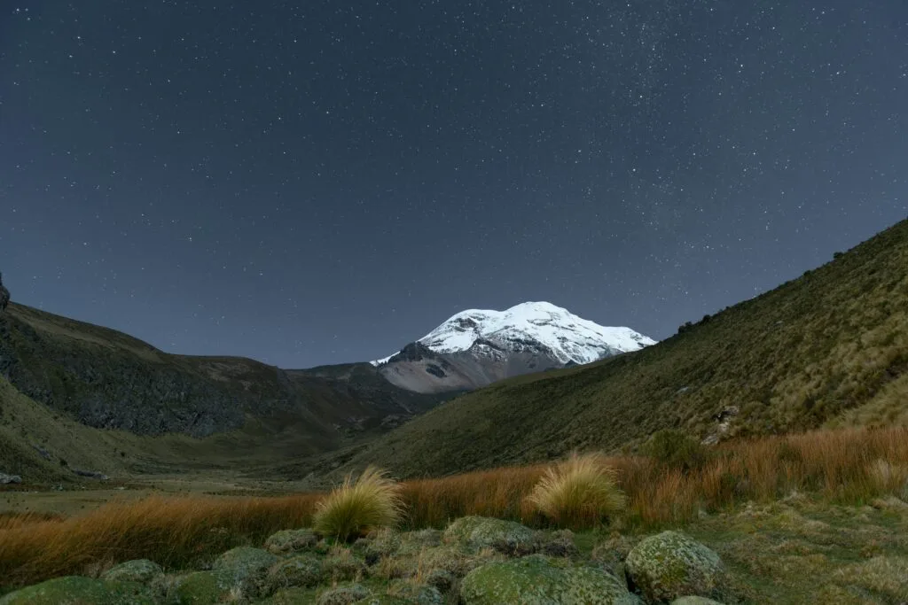 Chimborazo volcano towers over the paramo at night in Ecuador