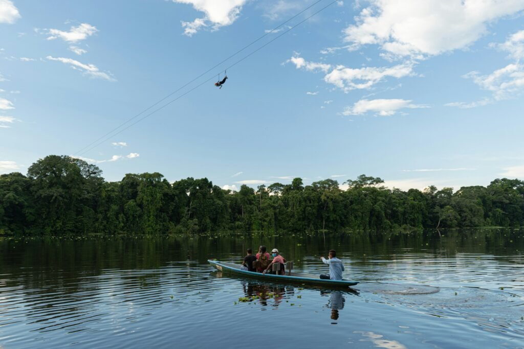 A small motorised canoe on a river in the Amazon, Ecuador