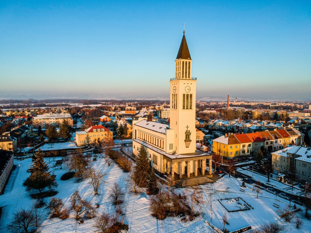 The Church of St Cyril and Methodius covered in snow in Czechia. Wheely Tyred Olomouc Christmas market