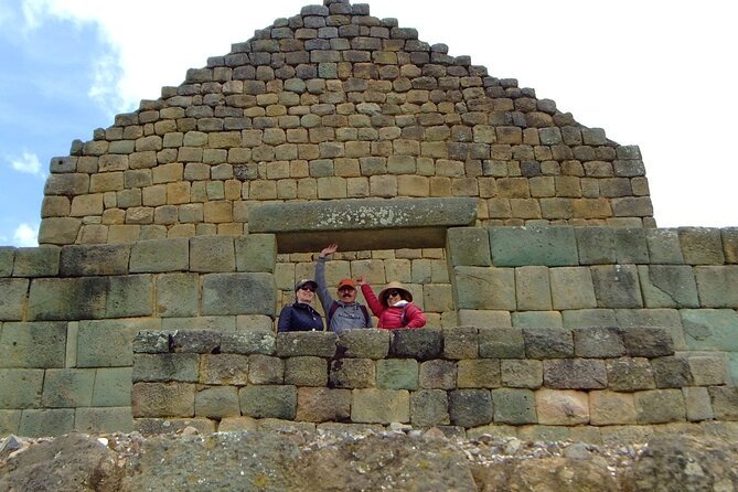 People look through the stone ruins at Ingapirca, near Cuenca, Ecuador