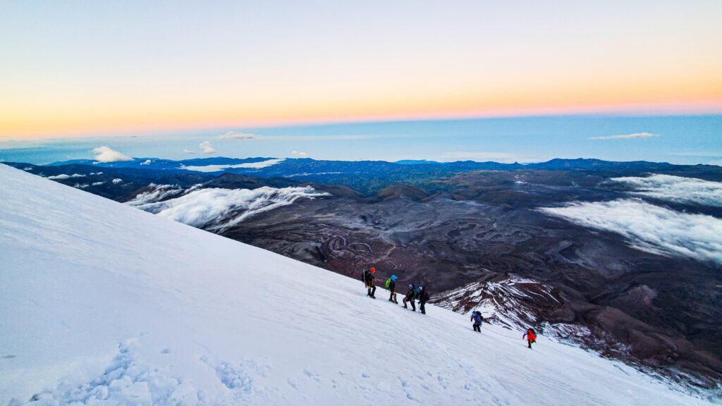 A group of people climb along the glacier on top of Chimborazo, Ecuador