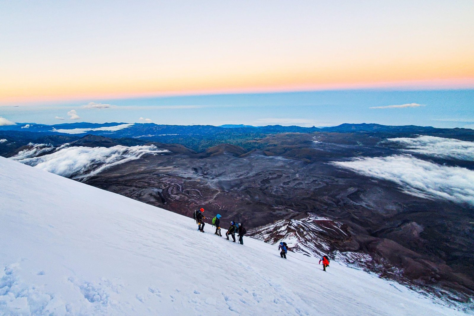 A group of people climb along the glacier on top of Chimborazo, Ecuador