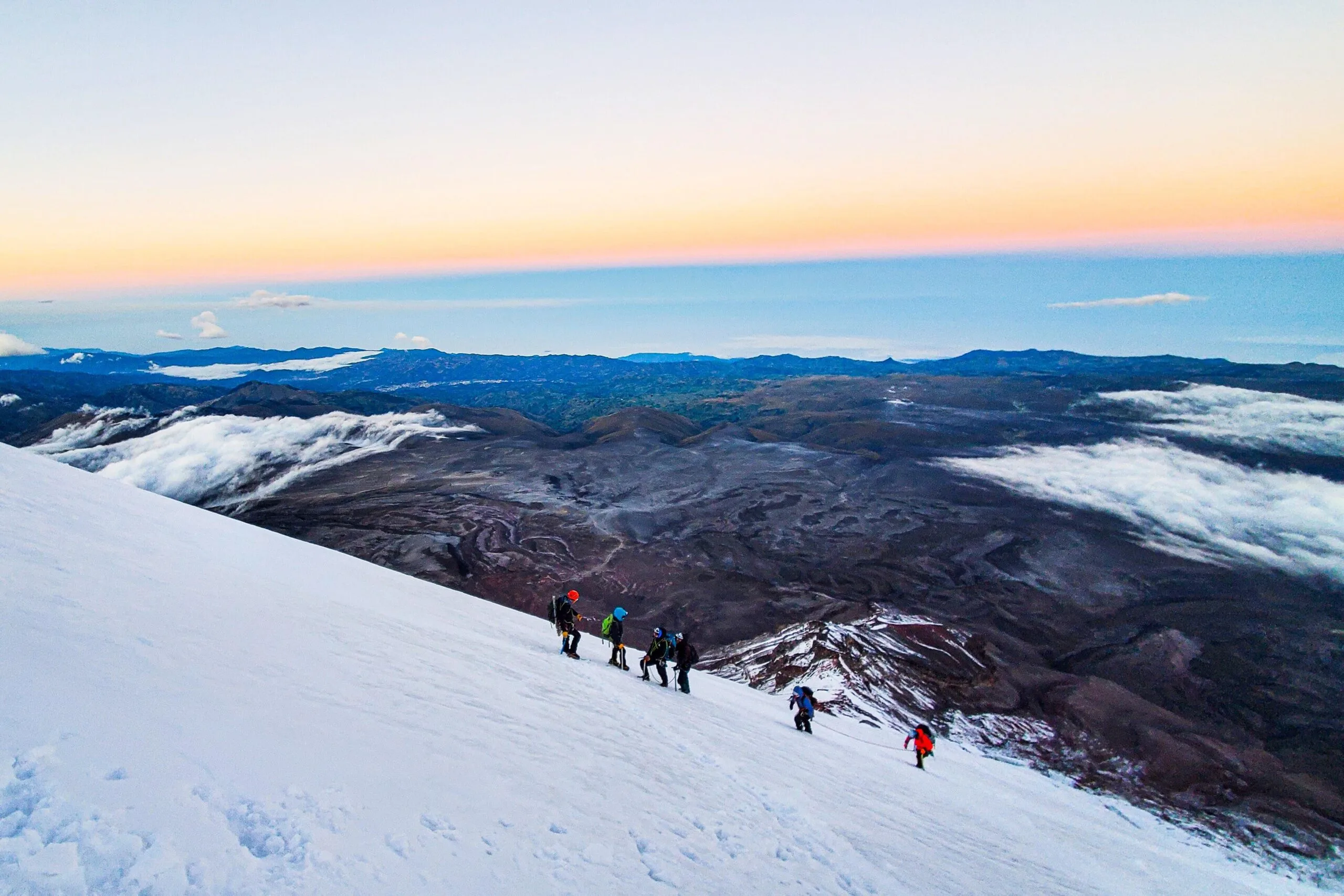 A group of people climb along the glacier on top of Chimborazo, Ecuador