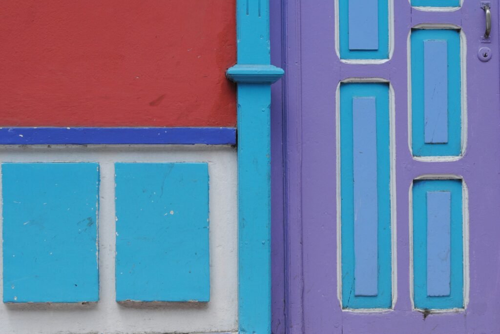 A detail of multicoloured wooden panels on a building in Loja, Ecuador