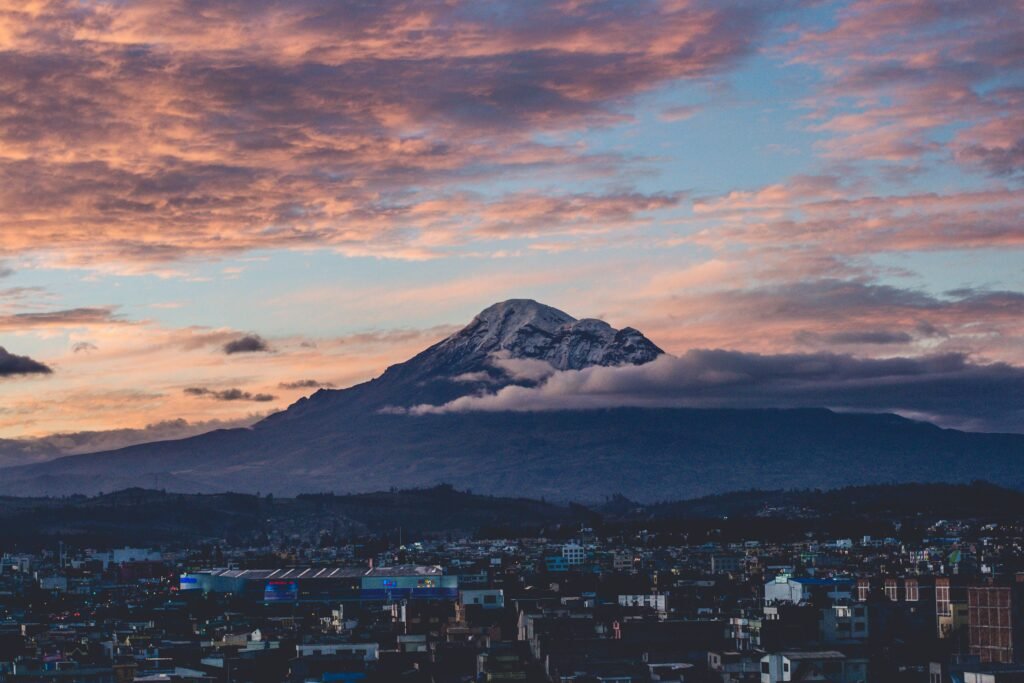 Chimborazo volcano towers over a city in Ecuador