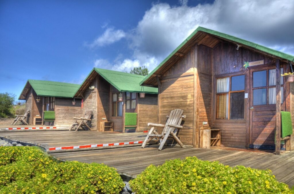 Wooden guesthouses at the Floreana Lava Lodge on the Galapagos Islands, Ecuador